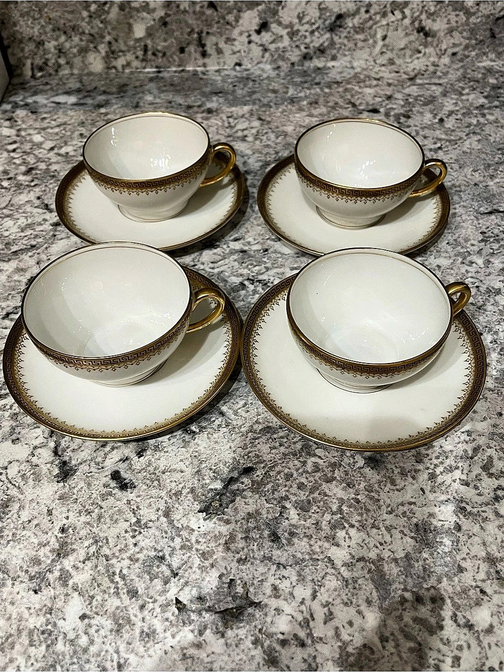 Limoges Four-Piece Gold Trim Tea Cup and Saucer Set